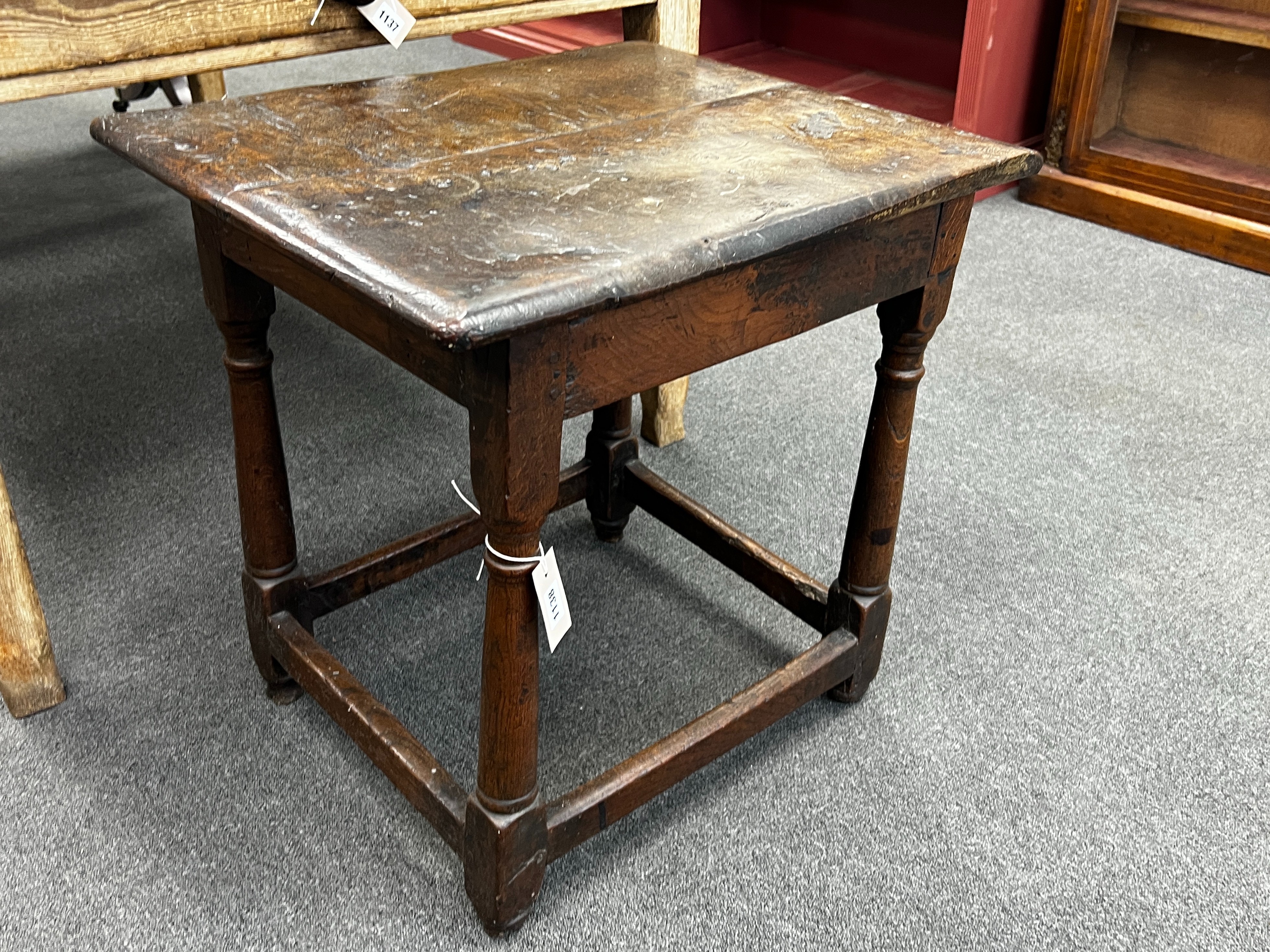 A 17th century rectangular oak small table with twin planked top, width 62cm, depth 52cm, height 61cm